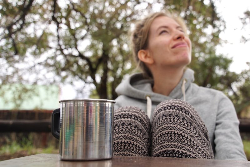 That Backpacker Audrey Bergner enjoying a warm cup of coffee whilst on safari at Kruger National Park in South Africa 