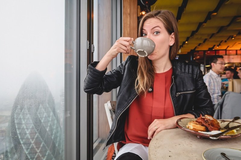That Backpacker Audrey Bergner enjoying tea on a fine autumn day in London with it being a wee bit atmospheric looking out of the window in Europe That Backpacker Audrey Bergner enjoying tea on a fine autumn day in London with it being a wee bit atmospheric looking out of the window in Europe