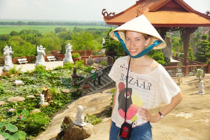 That Backpacker Audrey Bergner enjoying temple views wearing a conical hat in Vietnam during our Mekong Delta Tour That Backpacker Audrey Bergner enjoying temple views wearing a conical hat in Vietnam during our Mekong Delta Tour