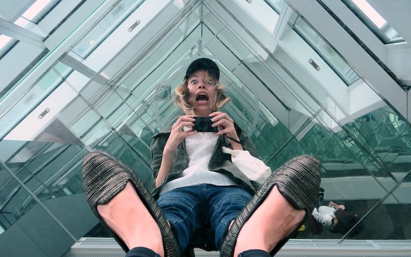 That Backpacker Audrey Bergner filming her reflection in Taipei Tower glass floor in Taiwan 