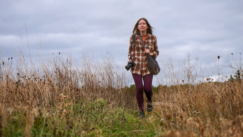 That Backpacker Audrey Bergner in her element exploring nature with camera in hand visiting Southern Cape Breton, Nova Scotia