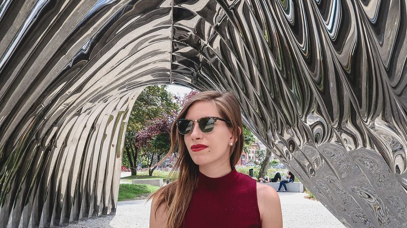 That Backpacker Audrey Bergner looking stylish next to the steel arches in Wroclaw, Poland That Backpacker Audrey Bergner looking stylish next to the steel arches in Wroclaw, Poland