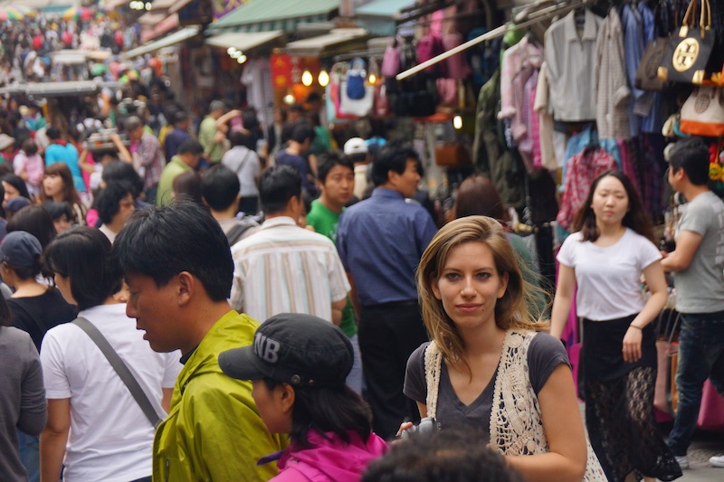 That Backpacker Audrey Bergner lost in a sea of crowd in a busy market in Seoul, South Korea 