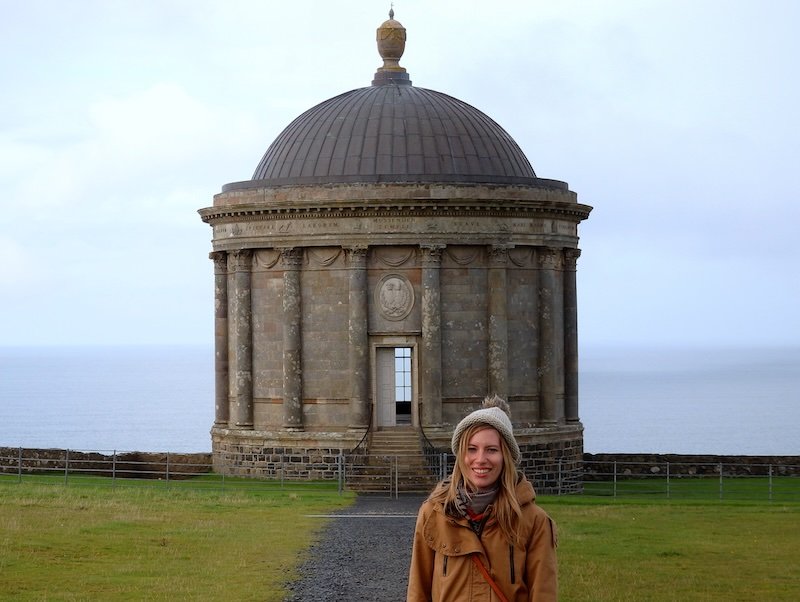 That Backpacker Audrey Bergner posing by distinct landmarks on the Ireland Road Trip 