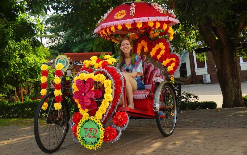 That Backpacker Audrey Bergner ready for a colourful rickshaw tour of Malacca, Malaysia playing tourist for the day That Backpacker Audrey Bergner ready for a colourful rickshaw tour of Malacca, Malaysia playing tourist for the day
