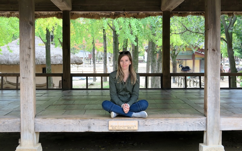 That Backpacker Audrey Bergner relaxing at the Korean Folk Village in a quiet area 