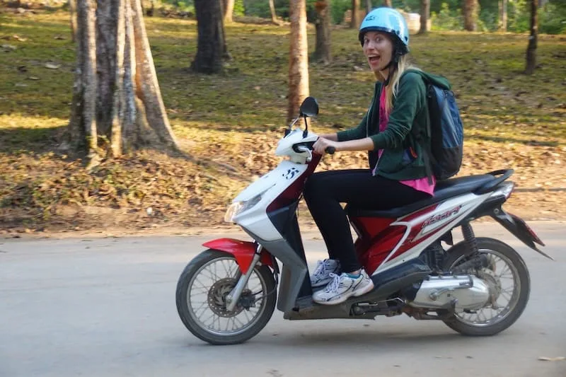That Backpacker Audrey Bergner riding a scooter in Pai, Thailand as a transportation option in SE Asia 