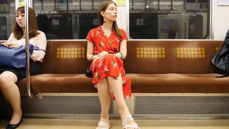 That Backpacker Audrey Bergner riding the subway metro in Osaka, Japan as a convenient way to get around the city in terms of transportation 