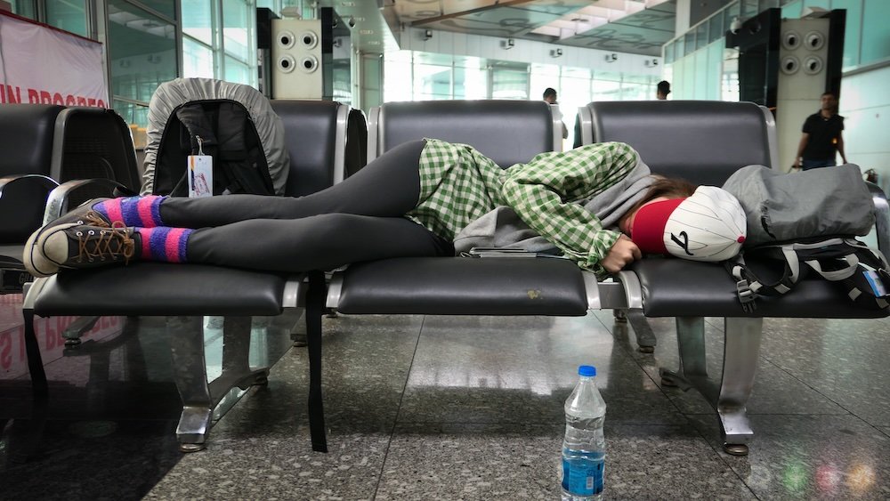 That Backpacker Audrey Bergner sleeping at the airport in Kolkata, India 