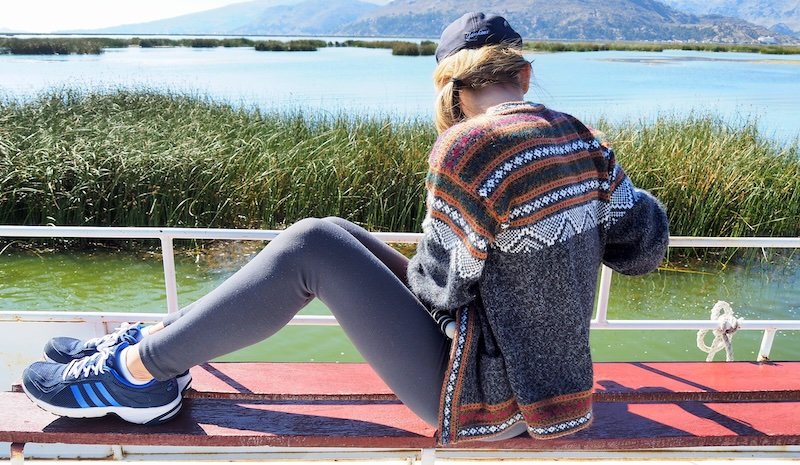 That Backpacker Audrey Bergner taking photos from the boat tour on Lake Titicaca, Peru 