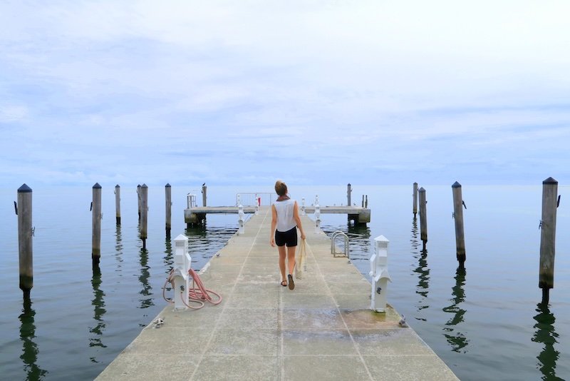 That Backpacker Audrey Bergner walking along the dock visiting the Florida Keys, USA 