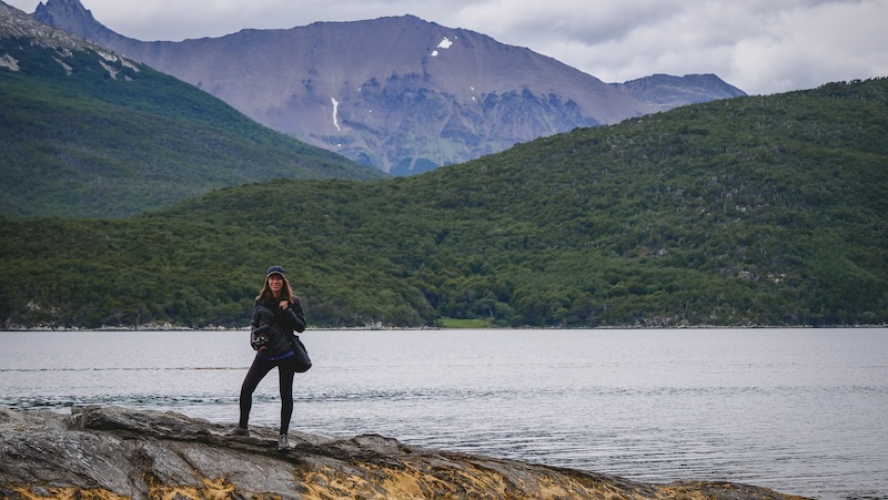 That Backpacker Audrey Bergner wearing a puffer jacket, fleece, hat and leggings hiking Tierra del Fuego National Park in Ushuaia, Argentina 