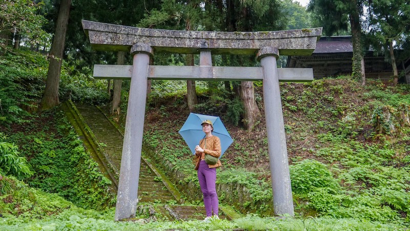 That Backpacker Audrey Bergner with an umbrella visiting temples in and around Yuzawa, Japan 