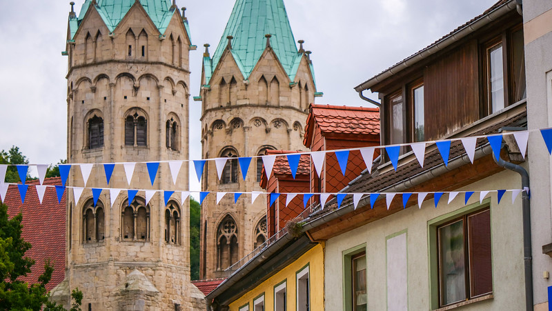 The church of St. Marien in Freyburg, Germany with macro detail views and colorful buildings in the foreground