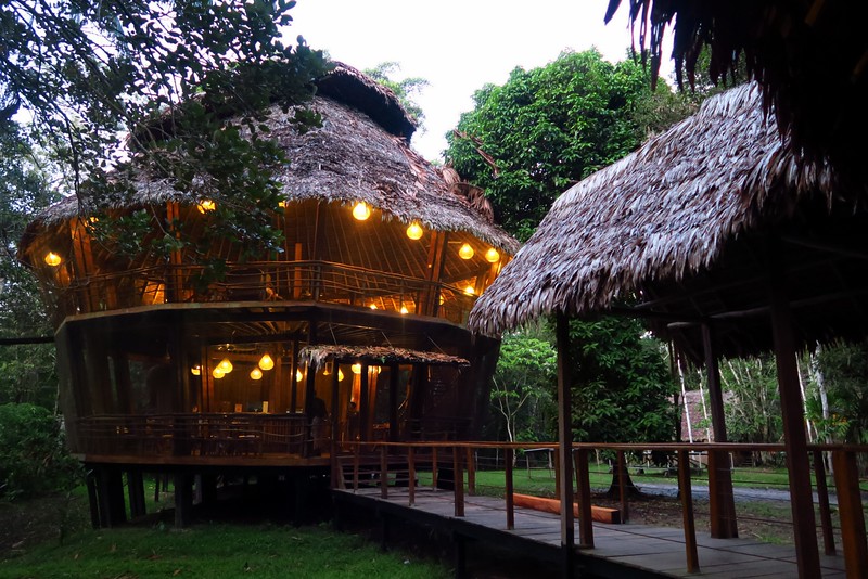 The Common Hall at the Treehouse Lodge all light up just before sundown in the Peruvian Amazon