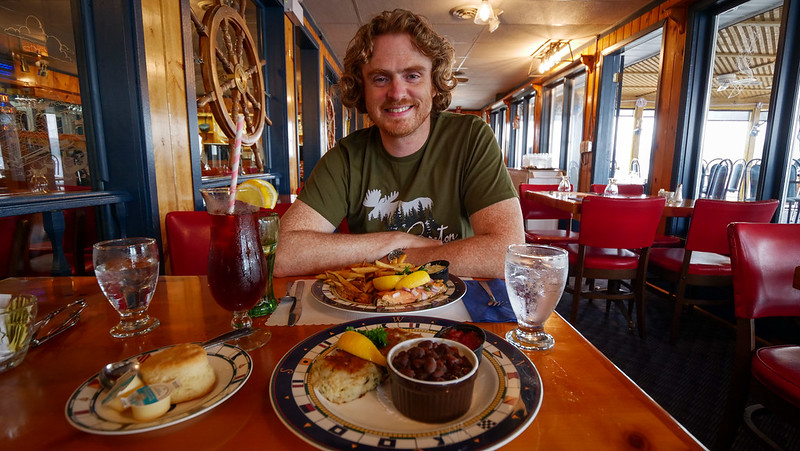 The Cove Restaurant has a strong nautical theme and seaside views with Nomadic Samuel excited and ready to eat his complete meal 