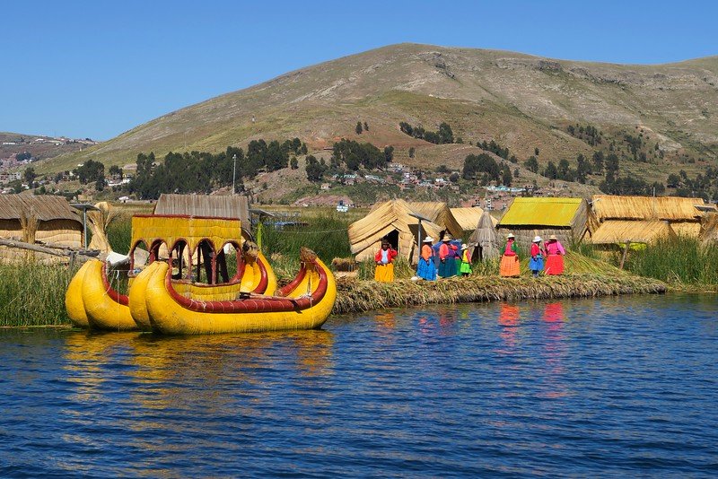 The floating reed islands of Uros on Lake Titicaca Peru - something you must add to your Peru travel itinerary!