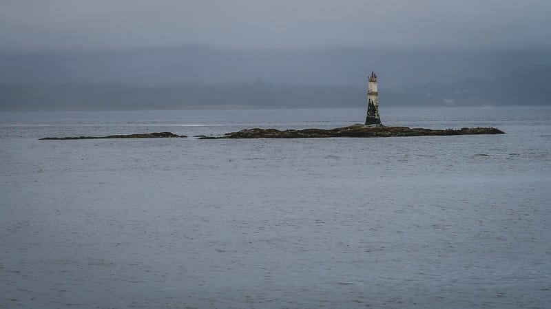 The lighthouse off the coast of Dunoon on a grey morning in Scotland 