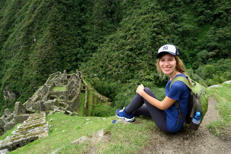 The ruins of Wiñay Wayna being enjoyed by adventure traveler Audrey Bergner That Backpacker in Peru 