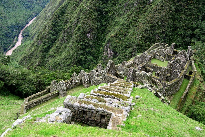 The ruins of Wiñay Wayna as seen from above contrasts human achievement versus raw nature and wilderness in Peru 