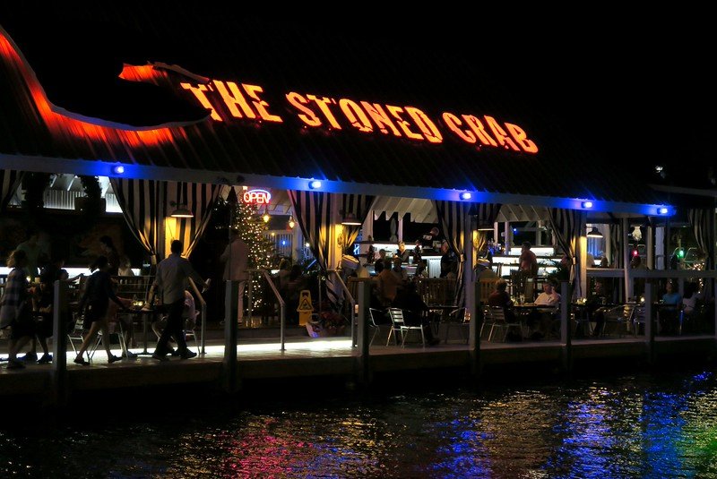 The Stoned Crab Restaurant while visiting the Florida Keys waterfront views at night with everything all lit up and fancy for visitors to the USA