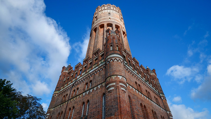 The water tower in Lüneburg, also known as the Wasserturm, as witnessed from a ground level vantage point in Germany 