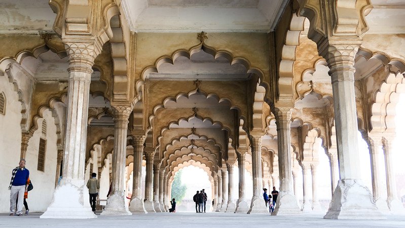 Touring Agra Fort with its giant archways and grandeur making visitors appear like tiny ants in Jaipur 