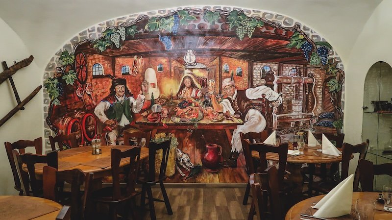 Traditional dining hall and decor inside a restaurant in Hungary 