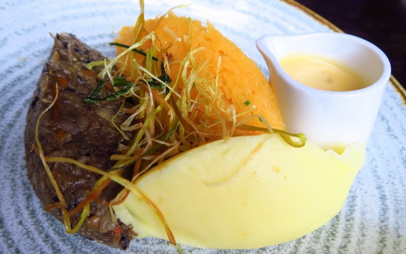 Traditional Scottish haggis served with mashed neeps and tatties plus whisky sauce on an Edinburgh food tour with Eat Walk Edinburgh