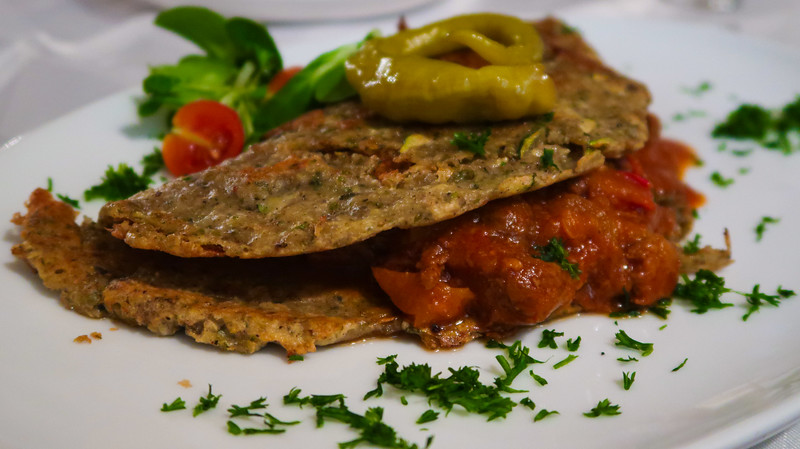 Traditional Slovak food at Prašná Bašta in Slovakia. This is potato and zucchini pancake stuffed with pork and beef tenderloin. Traditional Slovak food at Prašná Bašta in Slovakia. This is potato and zucchini pancake stuffed with pork and beef tenderloin.
