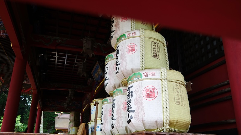 Traditional storage sake drums high atop Mount Takao, Japan 