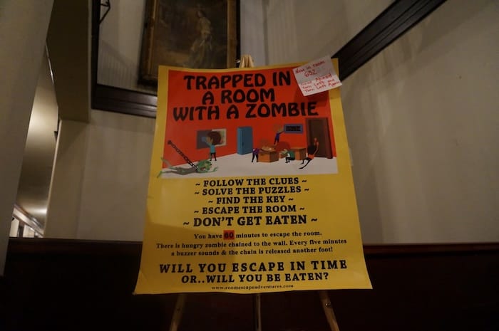Trapped in a room with a Zombie escape room game in Chicago poster 
