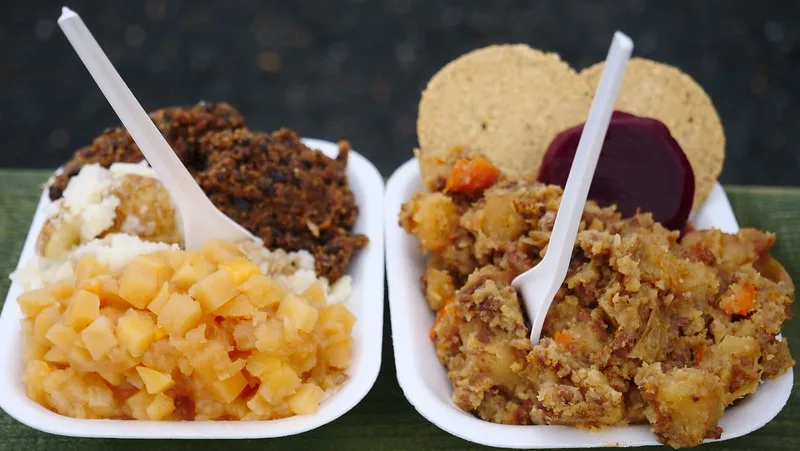 Trying Scottish food including beef stovies and haggis with neeps and tatties as hearty meals in Dunoon 