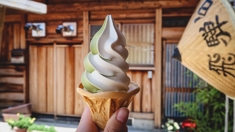 Trying soft-serve matcha ice cream in Shirakawa-go, Japan to beat the heat of a hot Japanese summer day Trying soft-serve matcha ice cream in Shirakawa-go, Japan to beat the heat of a hot Japanese summer day