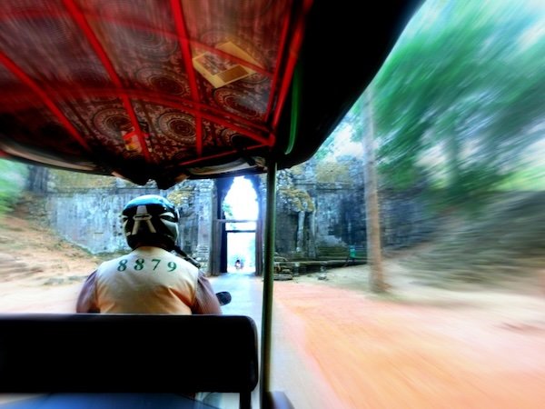 Tuk-tuk ride motion blur visiting the temples of Angkor, Cambodia 