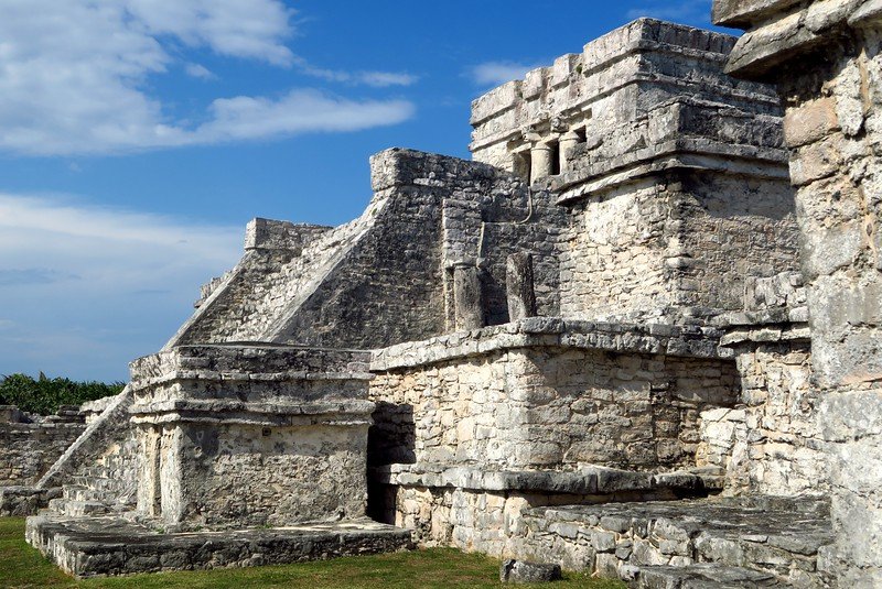 Ancient stone temples and pyramids at the Mayan ruins of Tulum, a popular day trip from Playa del Carmen, Mexico