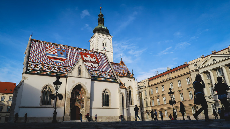 Unique and distinct architecture in Zagreb, Croatia featuring St Mark's Church from a wide angle vantage point