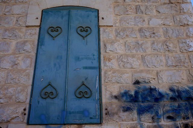 Unique blue door with distinct heart shapes spotted in Nazareth nearby Fauzi Azar Inn in Israel