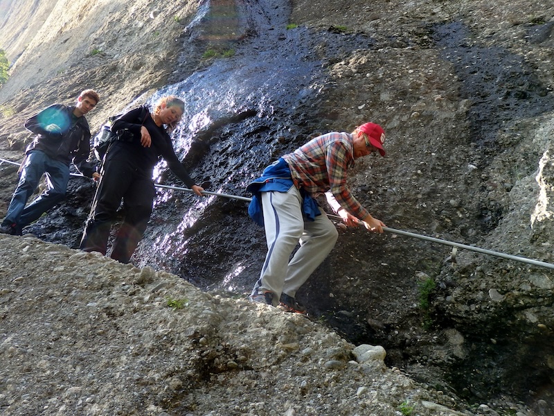 Using rope to get down tricky areas of a hike in Meteora, Greece 