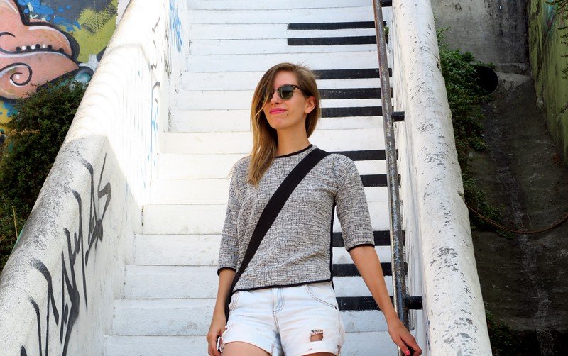 Traveler exploring the iconic piano staircase in Valparaíso, Chile, a famous street art landmark in Cerro Concepción that blends music, art, and urban creativity