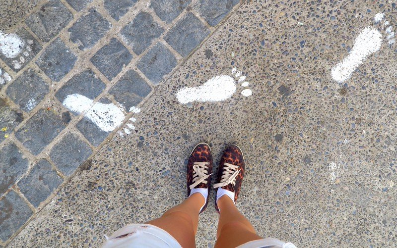 Following painted footsteps during a walking tour of Valparaíso, Chile, exploring the city’s colorful streets and vibrant urban art scene