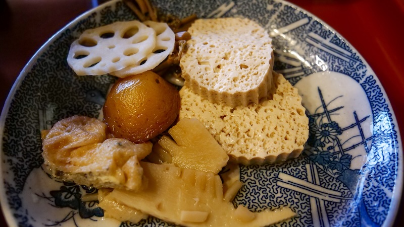 Vegetarian and vegan food with assorted vegetables on a plate including lotus root in Takayama, Japan Vegetarian and vegan food with assorted vegetables on a plate including lotus root in Takayama, Japan