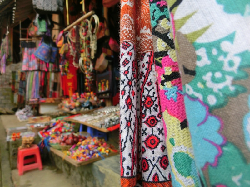 Vietnam souvenir shopping guide with an assortment of colorful things for sale in Sapa, Vietnam 