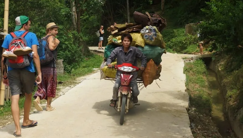 Vietnamese man carrying an insane amount of cargo on a scooter in Sapa, Vietnam 