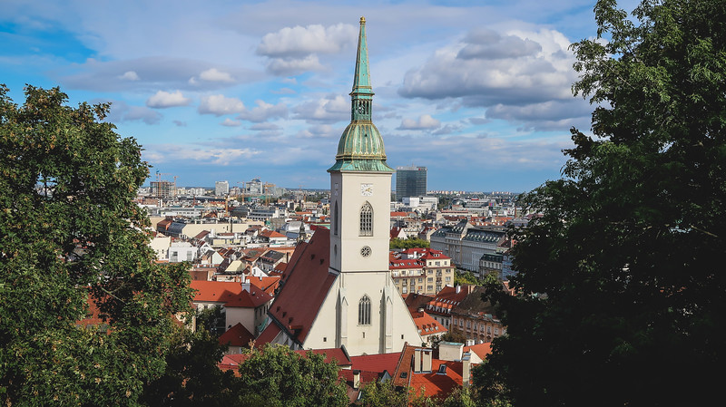 View of St. Martin’s Cathedral from Bratislava Castle framed by trees in Slovakia View of St. Martin’s Cathedral from Bratislava Castle framed by trees in Slovakia