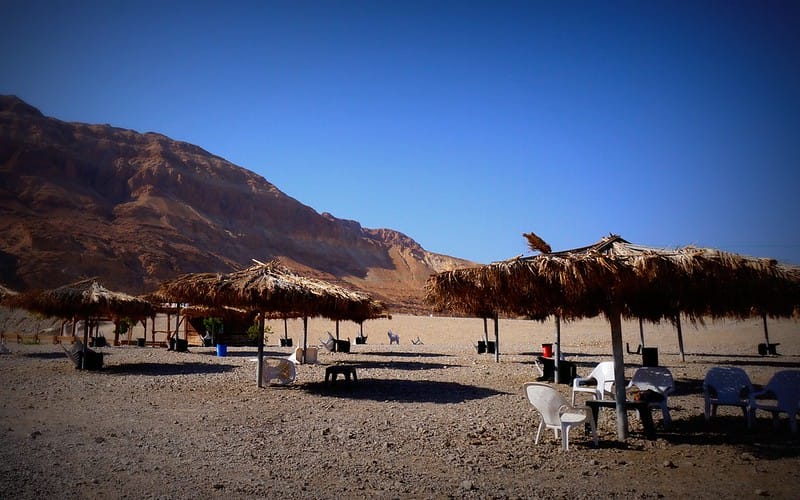 Views from Mineral Beach while visiting the Dead Sea, Israel with beach huts and chairs to relax