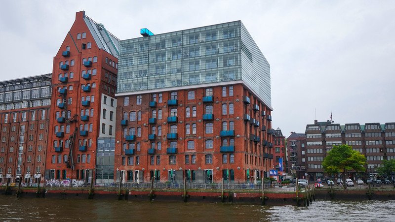 Views from the boat tour of Hamburg's River Elbe with distinct red brick buildings with modern features in Germany Views from the boat tour of Hamburg's River Elbe with distinct red brick buildings with modern features in Germany