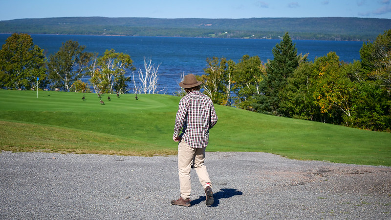 Views from the golf course at Dundee Resort & Golf Club with lakeside views and a wandering Nomadic Samuel taking it all in 