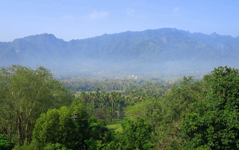 Views from the top of Borobudur Temple in Indonesia for mountain views and lush greenery 