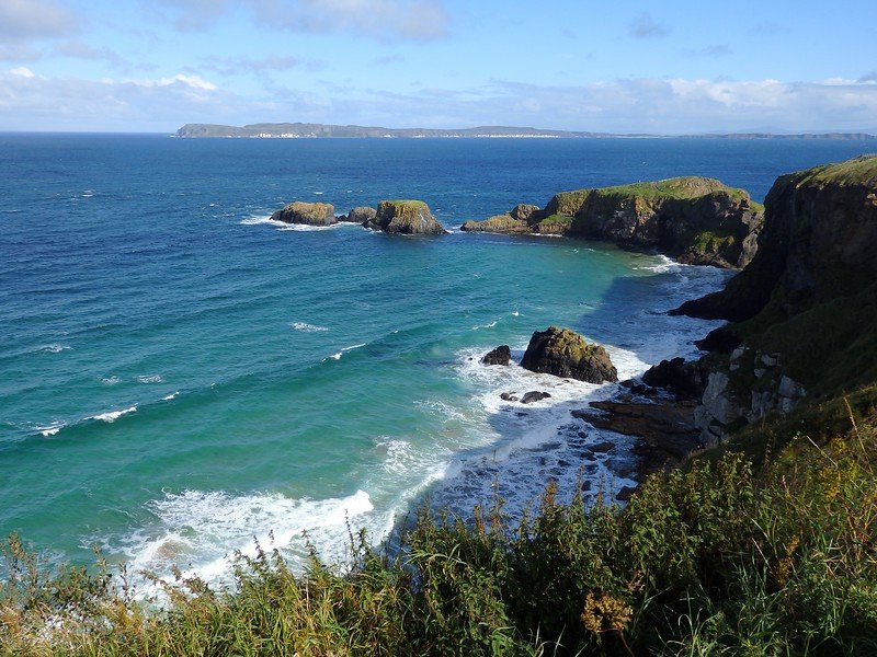Views near Carrick-a-Rede Rope Bridge with crashing into the coast with might and force 